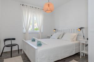 Postel nebo postele na pokoji v ubytování New and chic place near Old Town of Trogir