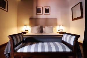 Łóżko lub łóżka w pokoju w obiekcie Hotel Escuela Rural Casa Los Herrera