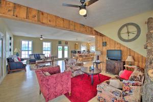 a living room with couches and a tv at Secluded Anglers Haven - Boat and Fish! 