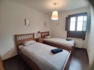 Postel nebo postele na pokoji v ubytování Mirador de Leres
