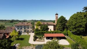 an aerial view of a mansion with a clock tower at Pampucet in Colcavagno