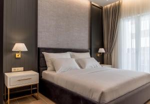 Łóżko lub łóżka w pokoju w obiekcie Buldero Boutique