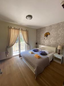 Postel nebo postele na pokoji v ubytování Apartments Serenity