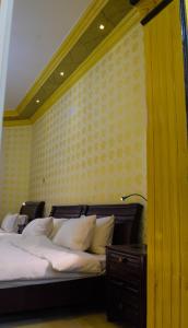 Ein Bett oder Betten in einem Zimmer der Unterkunft Arabian Lodges