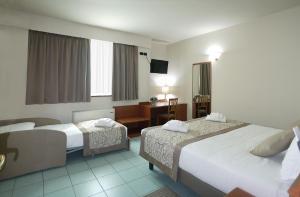 Postel nebo postele na pokoji v ubytování ALA Hotel + 31 fotografií