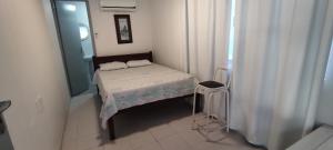 A bed or beds in a room at DK3 - CaSA COM 3 SUITES COM PISCINA BRUNO KLEMTZ