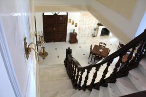 a staircase in a house with a table and a door at Villa Bice in Pulsano