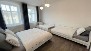 Postel nebo postele na pokoji v ubytování R&J apartmány