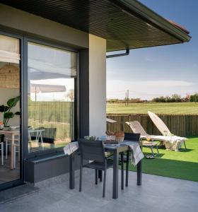A patio or other outdoor area at OCEANSUITESLANGRE
