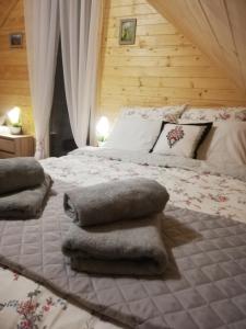 Postel nebo postele na pokoji v ubytování GRABSKA OSADA APARTAMENTY - 100m od Suntago Park-domki ogrzewane całoroczne