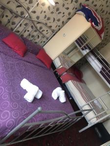 a bunk bed with white socks and towels on it at White Moon Hotel in Blackpool