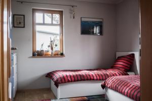 Tempat tidur dalam kamar di Ferienhaus Schiller
