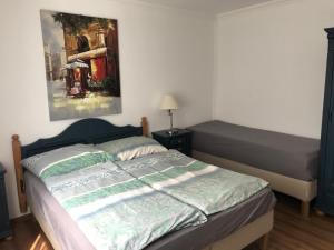 מיטה או מיטות בחדר ב-Xénia Apartmanok