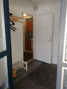 an open door to a room with a kitchen at Huoneisto Villa Kaitera in Kuusamo