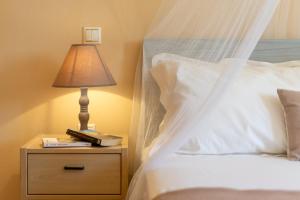 A bed or beds in a room at Liogerma Resorts