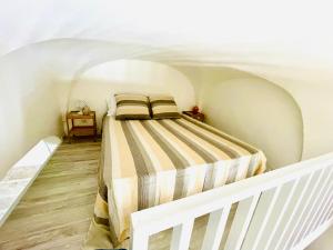 Posteľ alebo postele v izbe v ubytovaní WHITE STONE- La Terrazza