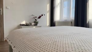 Postel nebo postele na pokoji v ubytování R&J apartmány