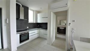 A kitchen or kitchenette at Isola Blu Luxury Apartment