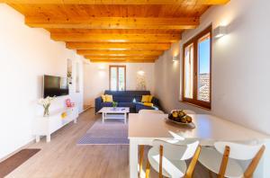 a living room with a table and a couch at Villa Aida in Komiža