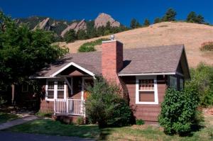 a house that has a tree on the top of it at Colorado Chautauqua Cottages in Boulder
