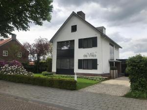 a white house with the words off views written on it at De Vlies in Venray