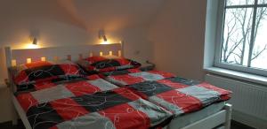 Postel nebo postele na pokoji v ubytování Pension Apartmány Harrachov 288