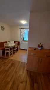 a kitchen and dining room with a table and chairs at Pension U Štěpánků in Trpišovice