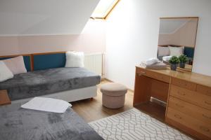 Postel nebo postele na pokoji v ubytování Apartman Villa Magdalena