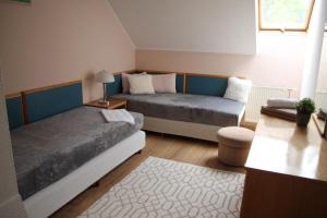 Postel nebo postele na pokoji v ubytování Apartman Villa Magdalena