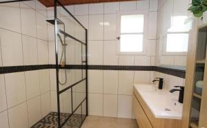 a bathroom with a shower and a sink at Le Galaveyson in Le Grand Serre