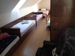 Postel nebo postele na pokoji v ubytování Pirtis Prie Neries Jonava