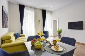 a living room with a table with fruit on it at D&A Central Luxury Apartments with FREE Parking in Pula
