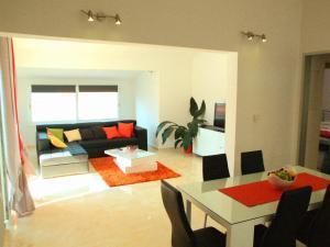 a living room with a couch and a table at House Merlin in Baška Voda