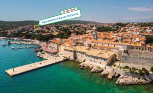 an aerial view of a town with a harbor at Apartments & Rooms Strčić Krk in Krk