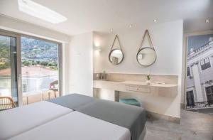 Кровать или кровати в номере Nama Sea Side Suites