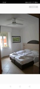 Cama o camas de una habitación en Hotel Sirena