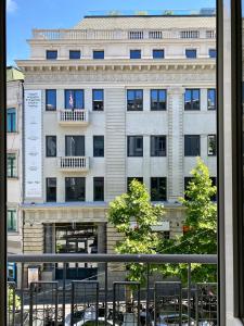 a view of a building from a window at Liberty Apartment in Tbilisi City