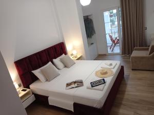 Postel nebo postele na pokoji v ubytování Vasiliu Boutique Hotel Ksamil