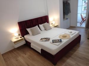 Postel nebo postele na pokoji v ubytování Vasiliu Boutique Hotel Ksamil