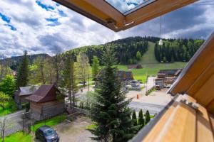a view from a gondola window of a mountain at Ania Wynajem Pokoi in Zakopane