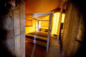 a bedroom with a bed in a room at VillaLaDiva Boutique Glamping in Massignano