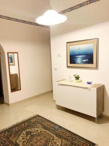 Televízia a/alebo spoločenská miestnosť v ubytovaní Apartment for 2 in Catania, B&B Le voci del mercato