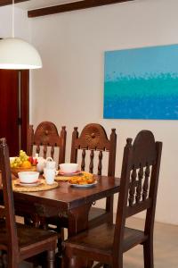 a wooden table with bowls of food on it at Apartments in Albufeira - Old Town in Albufeira