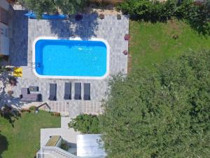 an overhead view of a swimming pool in a yard at Apartment 877-1 in Bibinje