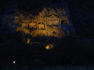 a building on the side of a mountain at night at Dalyan Pension in Dalyan
