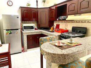 
A kitchen or kitchenette at Higuey Center City
