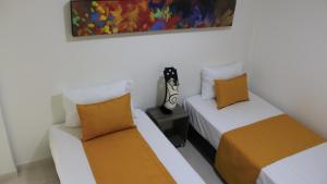 Ένα ή περισσότερα κρεβάτια σε δωμάτιο στο Hotel Pereira 421