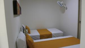 Ένα ή περισσότερα κρεβάτια σε δωμάτιο στο Hotel Pereira 421