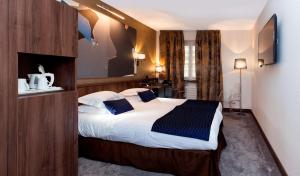 Postel nebo postele na pokoji v ubytování Best Western Plus Monopole Métropole
