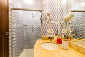 a bathroom with a sink and a shower at Casa Conceição in Fernando de Noronha +39 photos